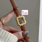 Montre Scottie - cuir marron et cadran doré (+ boîte + sac + ajusteur de bande)