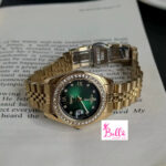 Montre Scottie - vert et bande dorée (+ boîte + sac + ajusteur de bande)