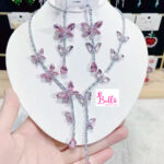 Ensemble de bijoux - collier et boucles d’oreilles papillon rose