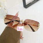 Lunette de soleil - marron avec détail papillon – Image 2